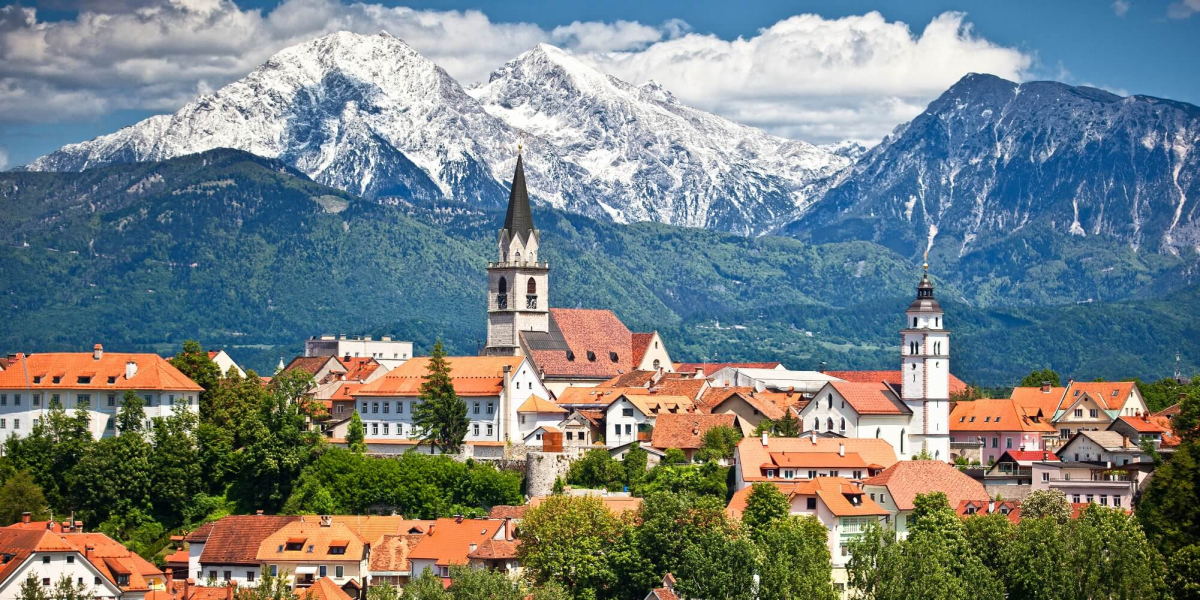 Kranj old town beneath the snow-capped Alps