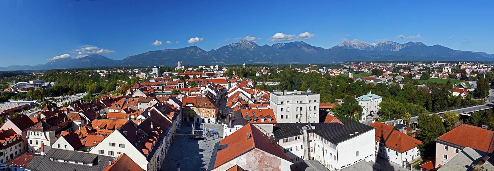 View over the old-town rooftops of Kranj to the Kamnik Alps