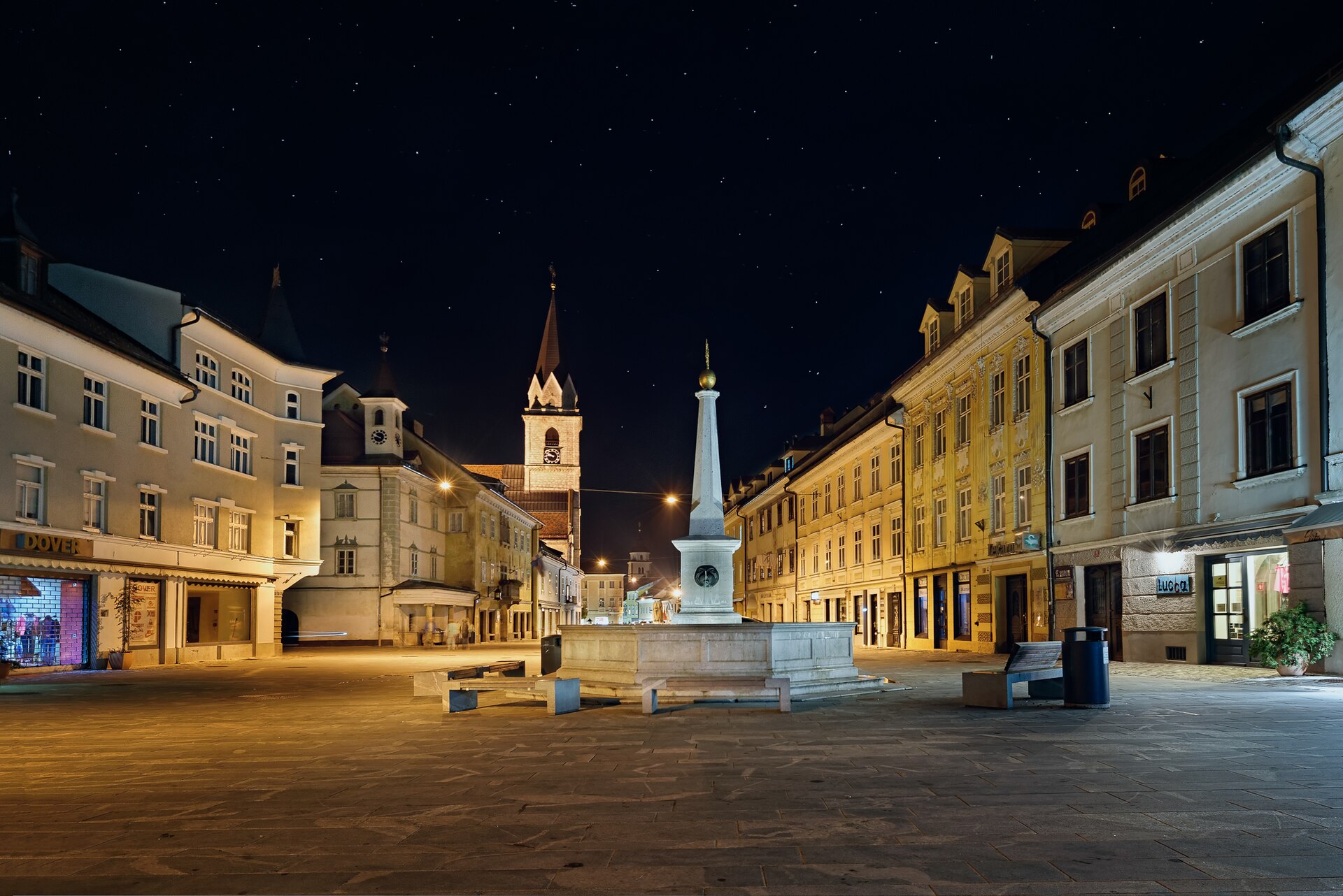 The main square of Kranj old town at night, lit and quiet